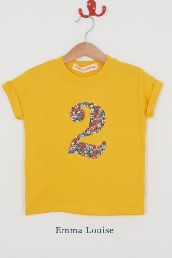 a yellow birthday t-shirt with a number 2 cut from emma louise liberty floral print on the front.