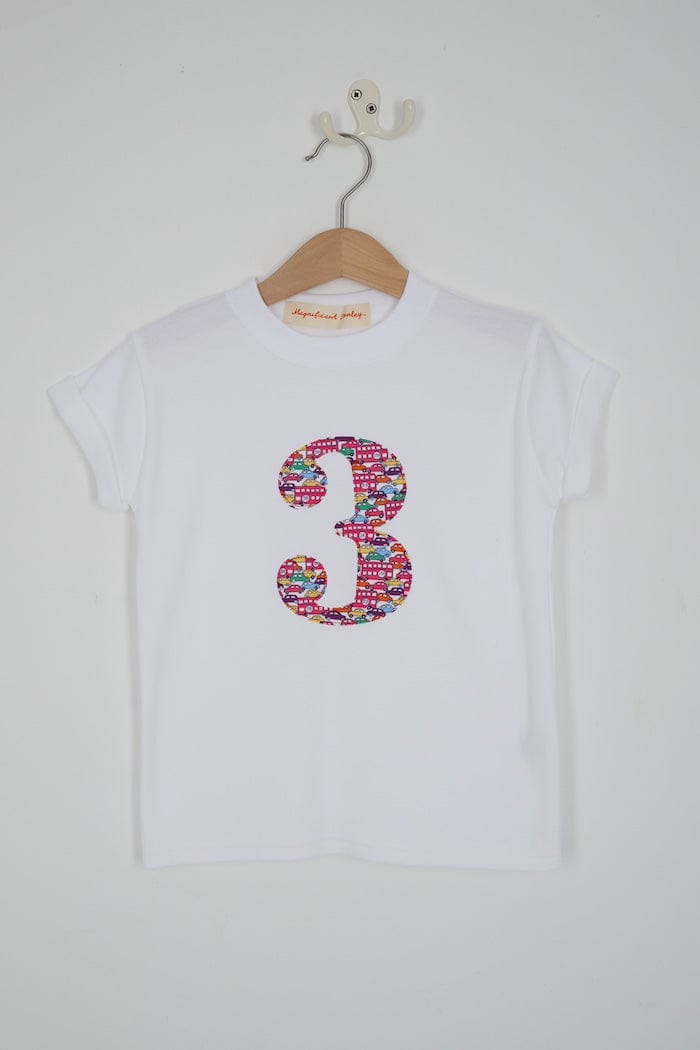a kids white t-shirt with a number 3 cut from Hop on hop off red cars and london bus liberty print on the front