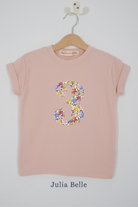 a pink 3rd birthday t-shirt with a number 3 cut from Julia Belle sparkly liberty floral print on the front