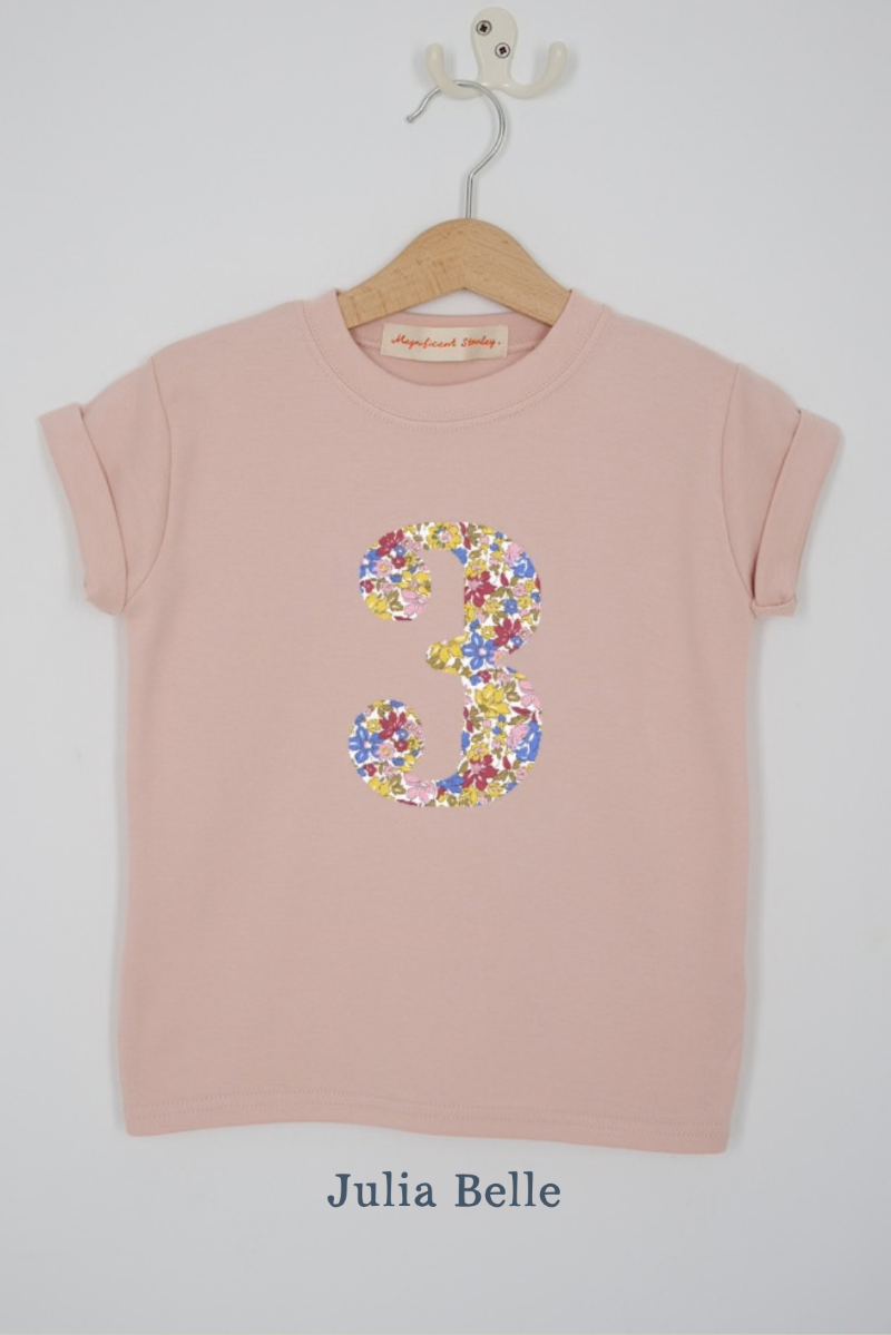 a pink 3rd birthday t-shirt with a number 3 cut from Julia Belle sparkly liberty floral print on the front
