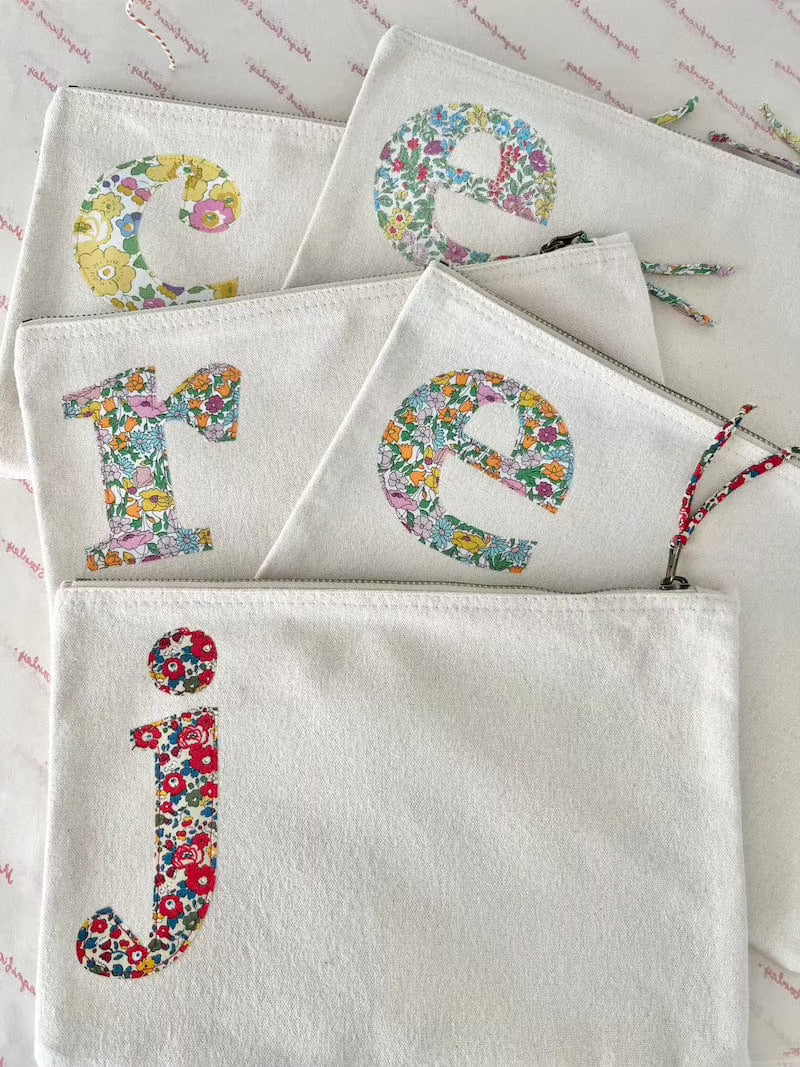 Personalised Liberty print pouches with initials sewn on them. Teacher gifts for make up or stationery.