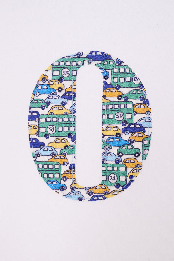 A close up of the stitching of an initial on a Personalised Bodysuit in Hop On Hop Off Liberty Print