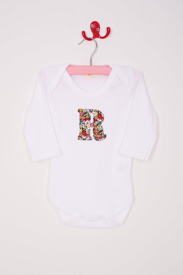  a Personalised initial baby Bodysuit in Libby floral Liberty Print. 