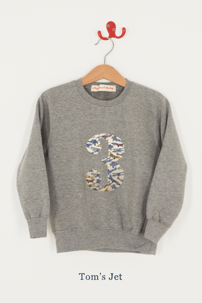 A birthday grey kids sweatshirt with a number 3 on in jet planes Liberty fabric.
