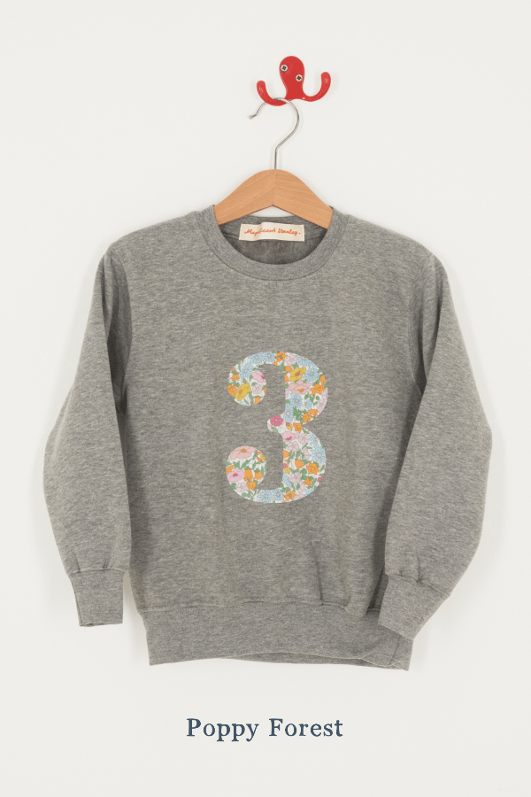 A birthday grey sweatshirt with a number 3 on in Poppy Forest Liberty fabric.