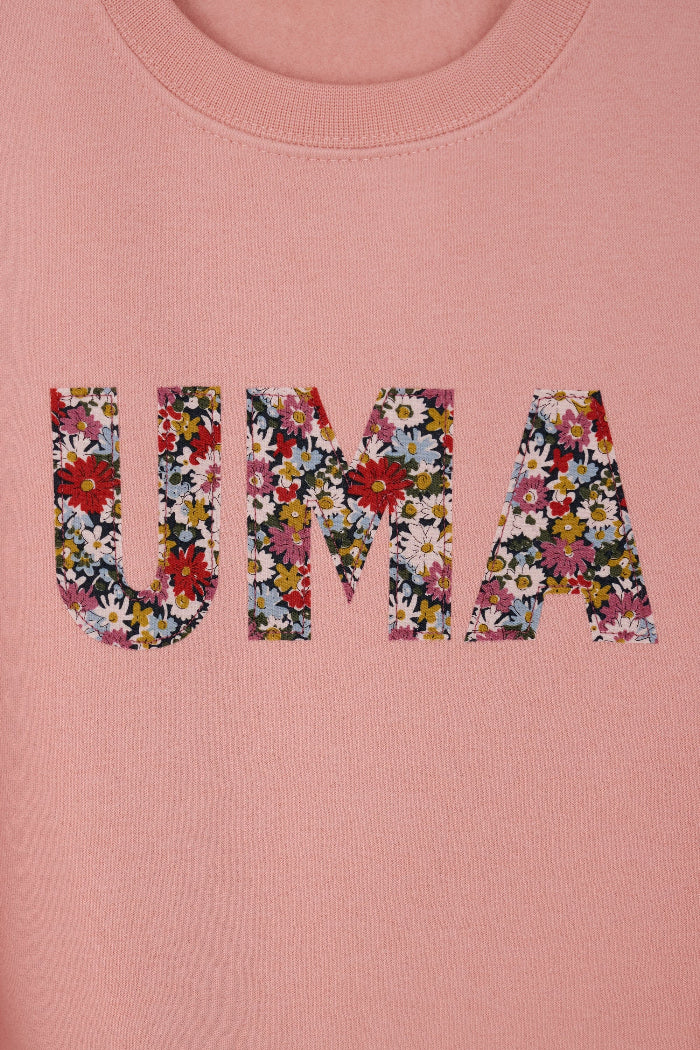 a Magnificent Stanley Dusty Pink Sweatshirt  with the name UMA sewn on in Libby floral Liberty Print