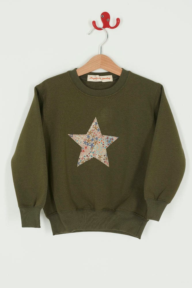 A Magnificent Stanley Khaki Christmas Jumper Sweatshirt with a star on the front made from Liberty Print fabric.