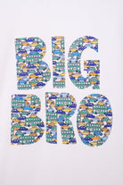 A close up of a white t-shirt with BIG BRO sewn onto it in vintage liberty cars print.