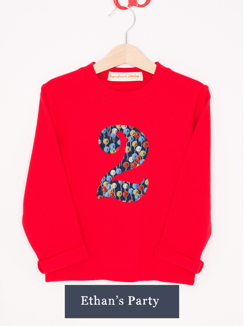 a Magnificent Stanley long sleeve Red birthday T-Shirt with the number 2 on the front in Ethan's party balloon Liberty Print