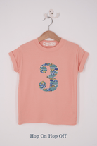 A pink birthday t-shirt with a number 3 on in Liberty cars print.