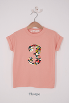 A pink birthday t-shirt with a number 3 on in Liberty floral print.