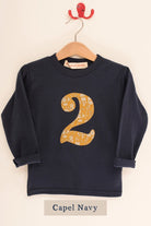 a navy birthday t-shirt with a number 2 cut from liberty capel floral print on the front