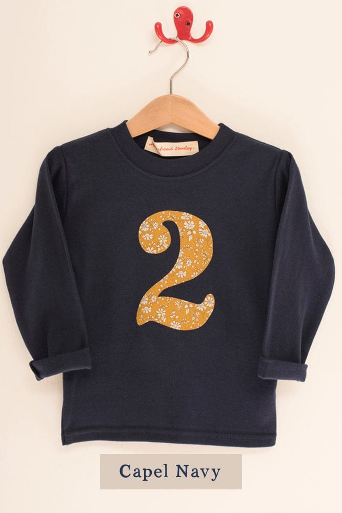 a navy birthday t-shirt with a number 2 cut from liberty capel floral print on the front