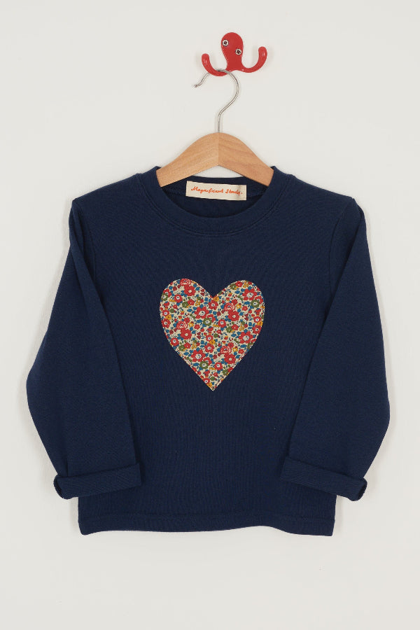 A navy cotton t-shirt with a Liberty floral heart sewn on the front.