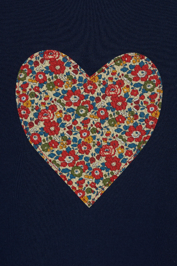 A navy cotton t-shirt with a Liberty floral heart sewn on the front.