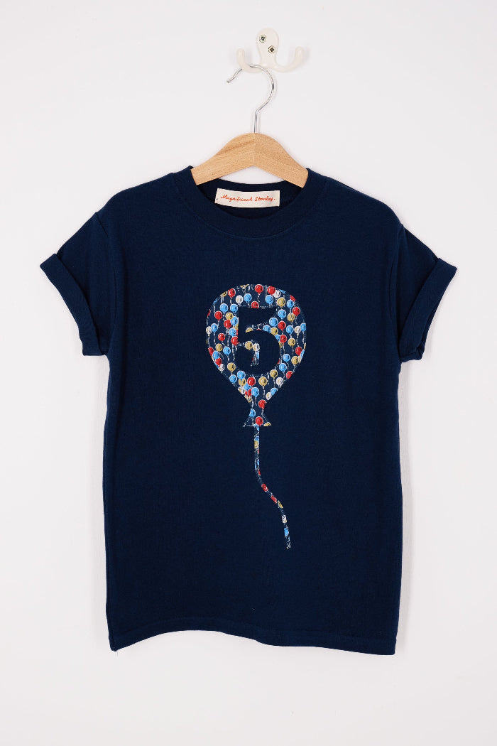 A navy t-shirt with a number 5 in a balloon on the front. The balloon is cut from Ethan's Party balloon Liberty print.