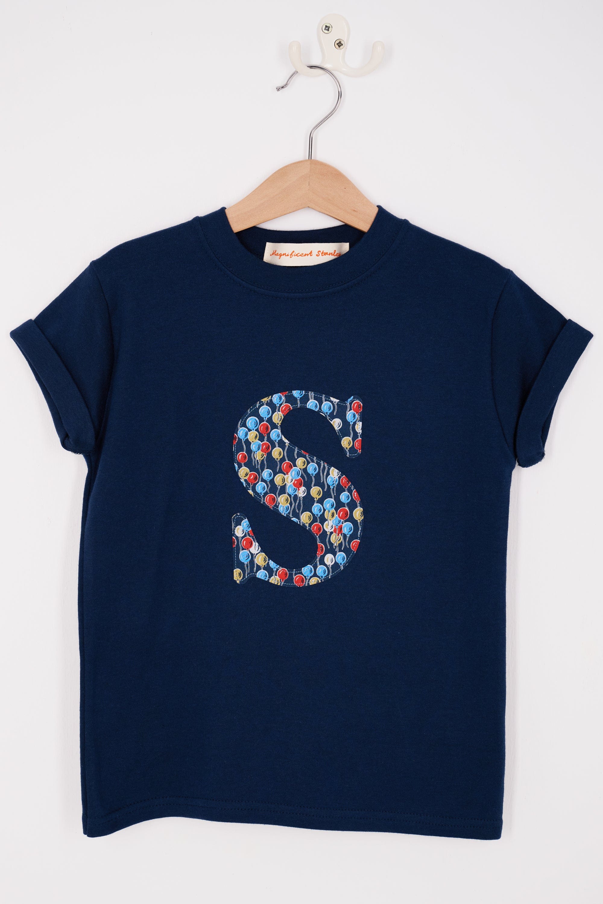 A navy cotton personalised t-shirt with an initial in Liberty balloon print.