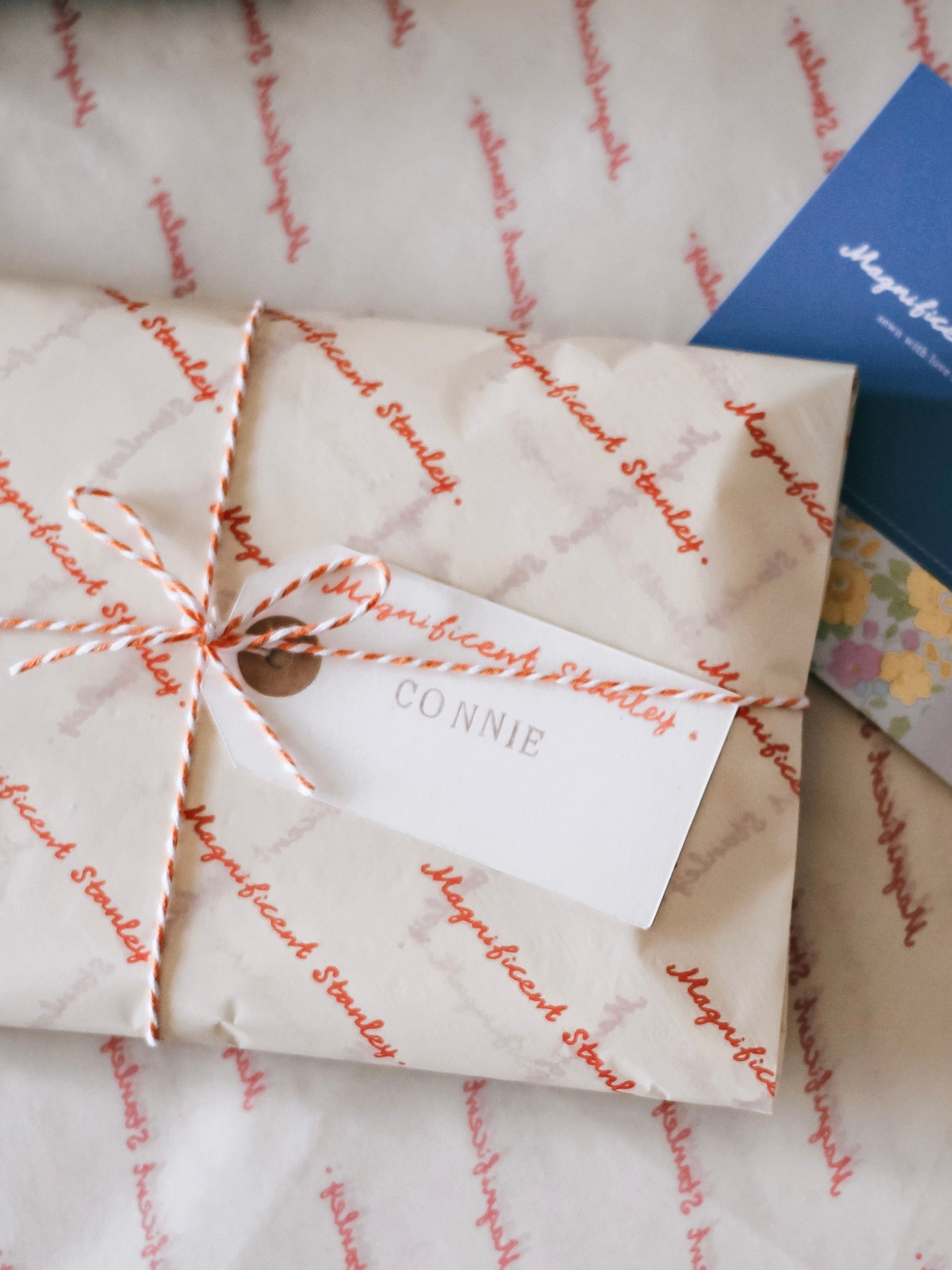 Magnificent Stanley Gift wrapped in logo tissue and twine with a hand stamped name tag.