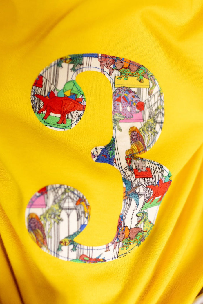 a birthday Number 3 Yellow cotton T-Shirt in Dinosaur Liberty Print.