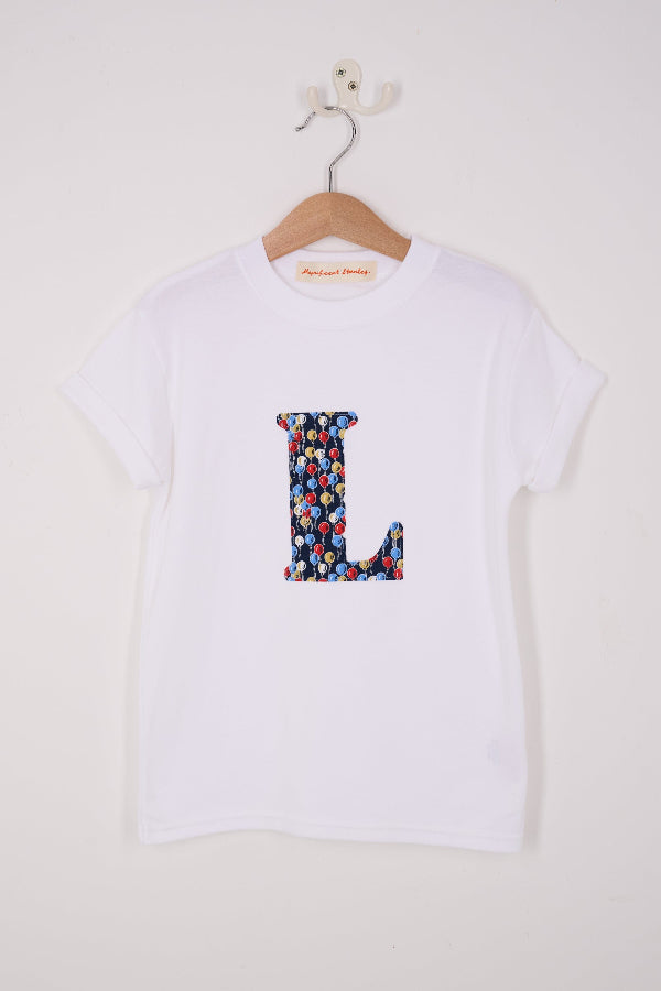 a personalised white cotton T-Shirt with an initial letter in Ethan's Party balloon Liberty Print.