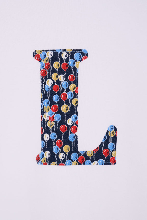 a personalised white cotton T-Shirt with an initial letter in Ethan's Party balloon Liberty Print.