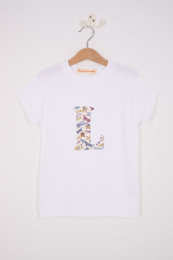 a personalised white cotton T-Shirt with an initial letter on the front in Toms Jet plane Liberty print