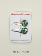 Two hair clips with liberty my little star design on a 'Magnificent Stanley' card.