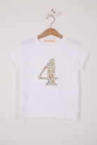 A white cotton birthday t-shirt with the number 4 sewn on the front cut from liberty Nazanin fabric