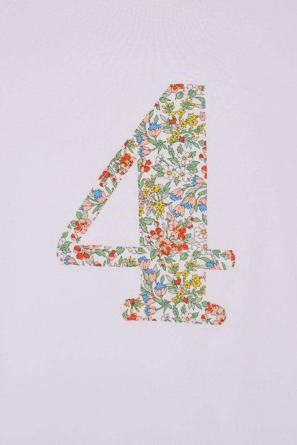 A white cotton birthday t-shirt with the number 4 sewn on the front cut from liberty Nazanin fabric