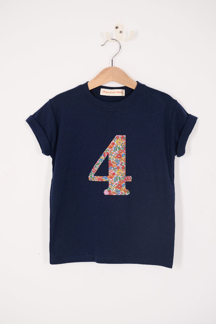 A navy cotton t-shirt with the number 4 sewn on the front cut from liberty floral Nell Annie and May print.