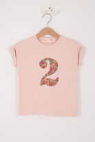  a pale pink t-shirt with a Liberty Nell Annie and May floral number '2' on the front