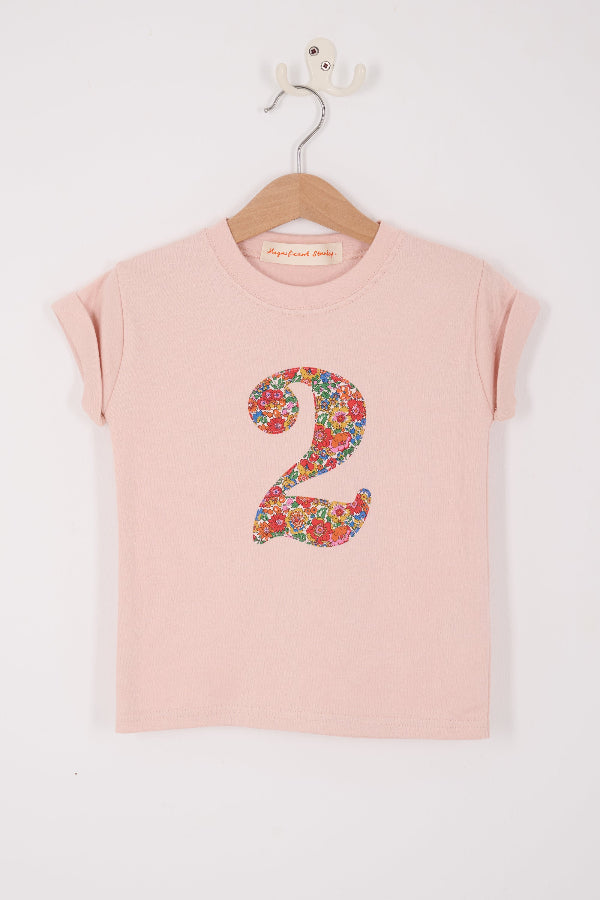  a pale pink t-shirt with a Liberty Nell Annie and May floral number '2' on the front
