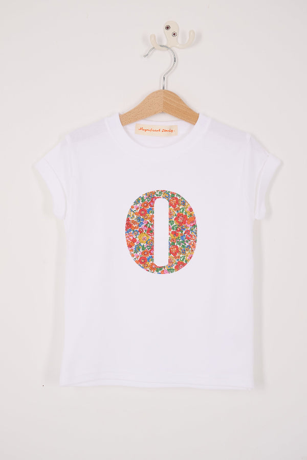 A summery personalised white cotton t-shirt with her initial cut from Nell Annie and May floral liberty fabric.