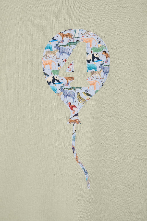 Balloon-shaped number '4' with animal pattern on a beige background