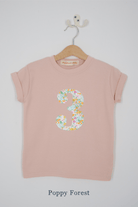 a pink 3rd birthday t-shirt with a number 3 cut from poppy forest liberty floral print on the front