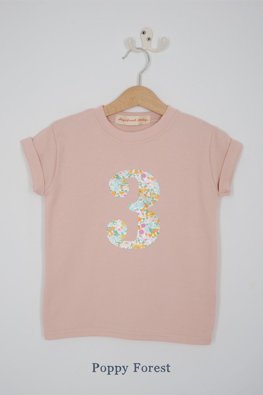 a pink 3rd birthday t-shirt with a number 3 cut from poppy forest liberty floral print on the front