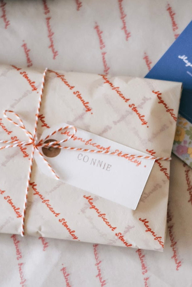 Magnificent Stanley Gift wrapped in logo tissue and twine with a hand stamped name tag