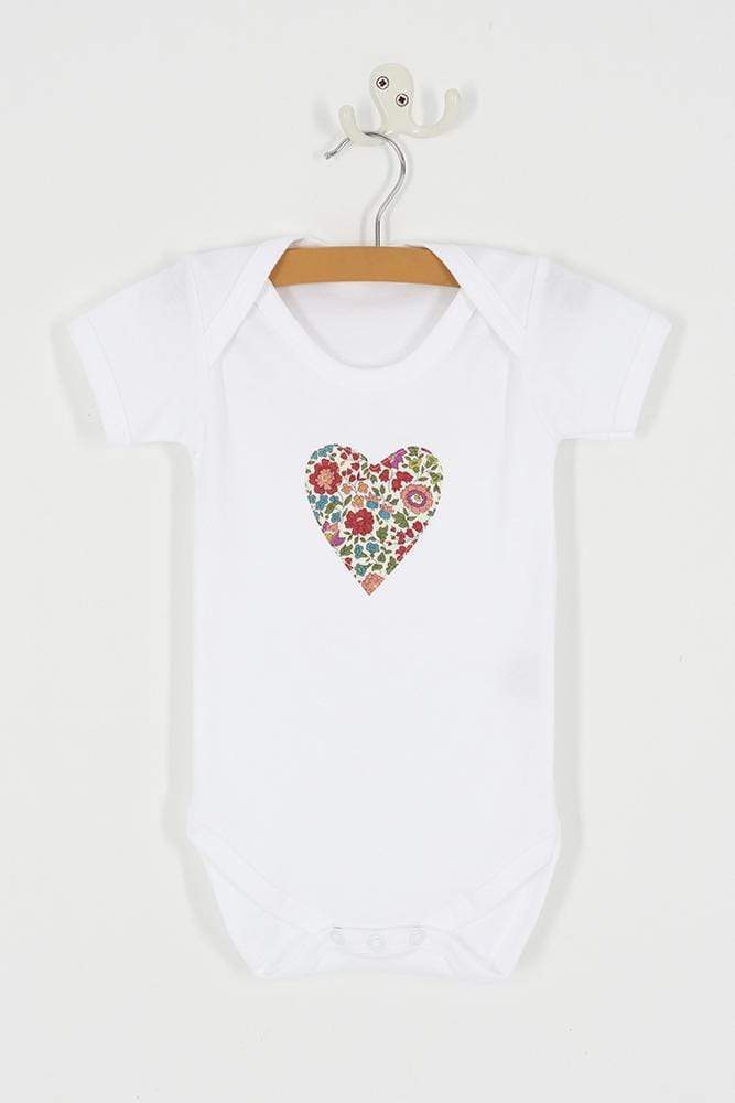 a bodysuit with a heart on made from d'anjo liberty print fabric