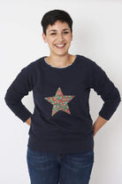 A Magnificent Stanley Ladies navy Christmas jumper with a festive Star in Wiltshire Liberty Print sewn on the front