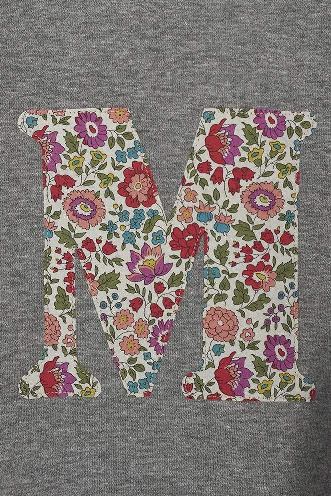 A personalised grey sweatshirt with an initial on in floral Liberty fabric.