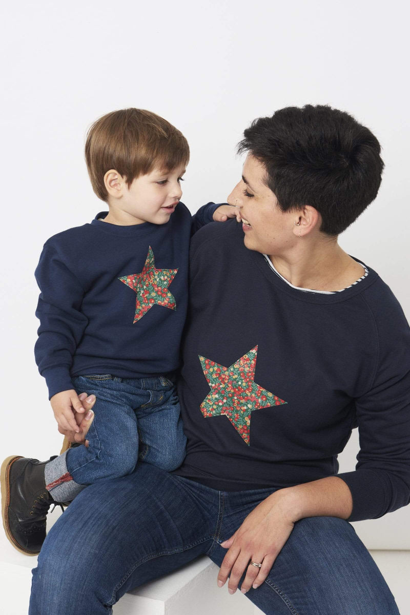 A Magnificent Stanley Ladies navy Christmas jumper with a festive Star in Wiltshire Liberty Print sewn on the front matching with her son