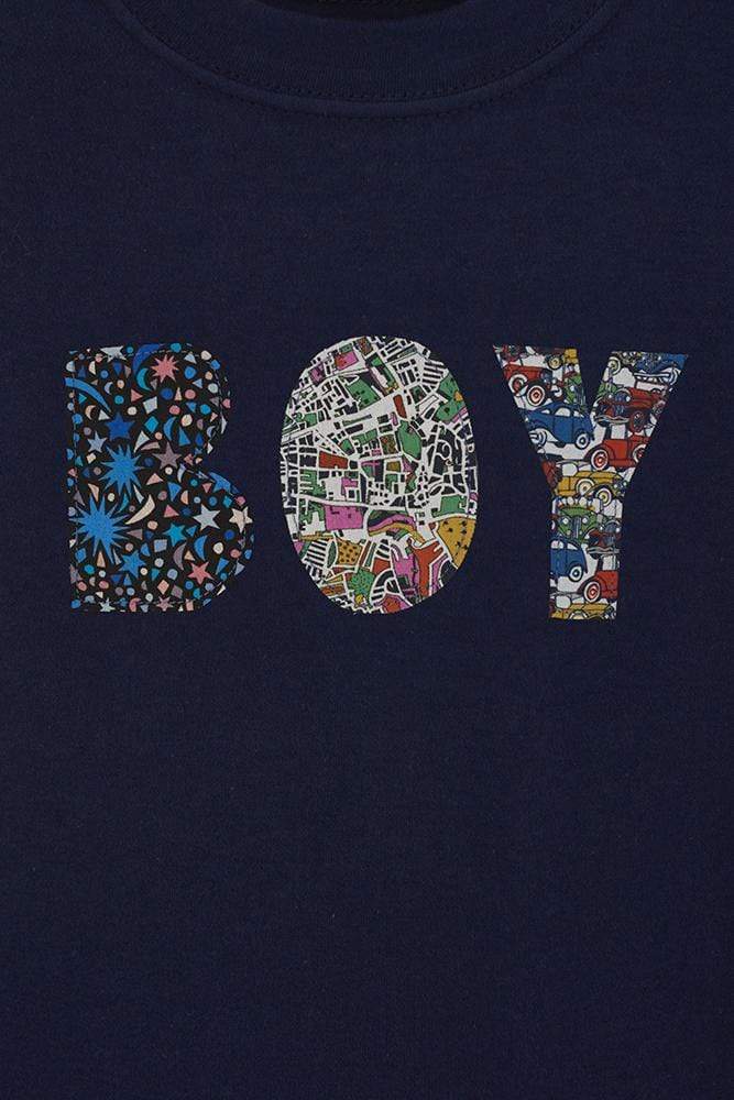 A close up of a  navy t-shirt with a name on in mixed Liberty fabrics.