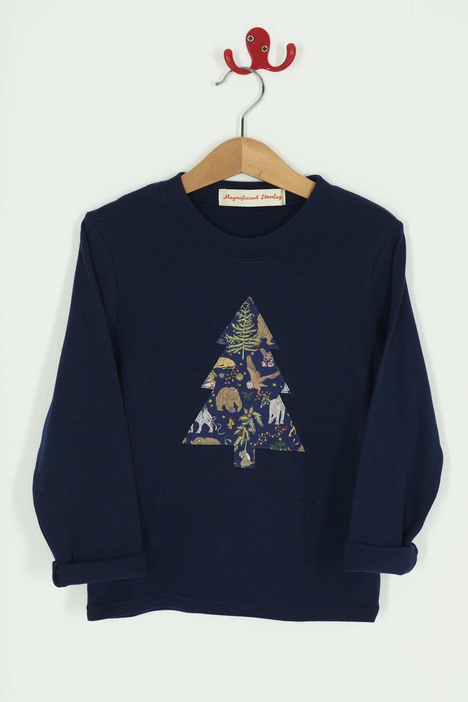 A navy long sleeve Christmas t-shirt with a Christmas Tree on the front made from Liberty Christmas print .