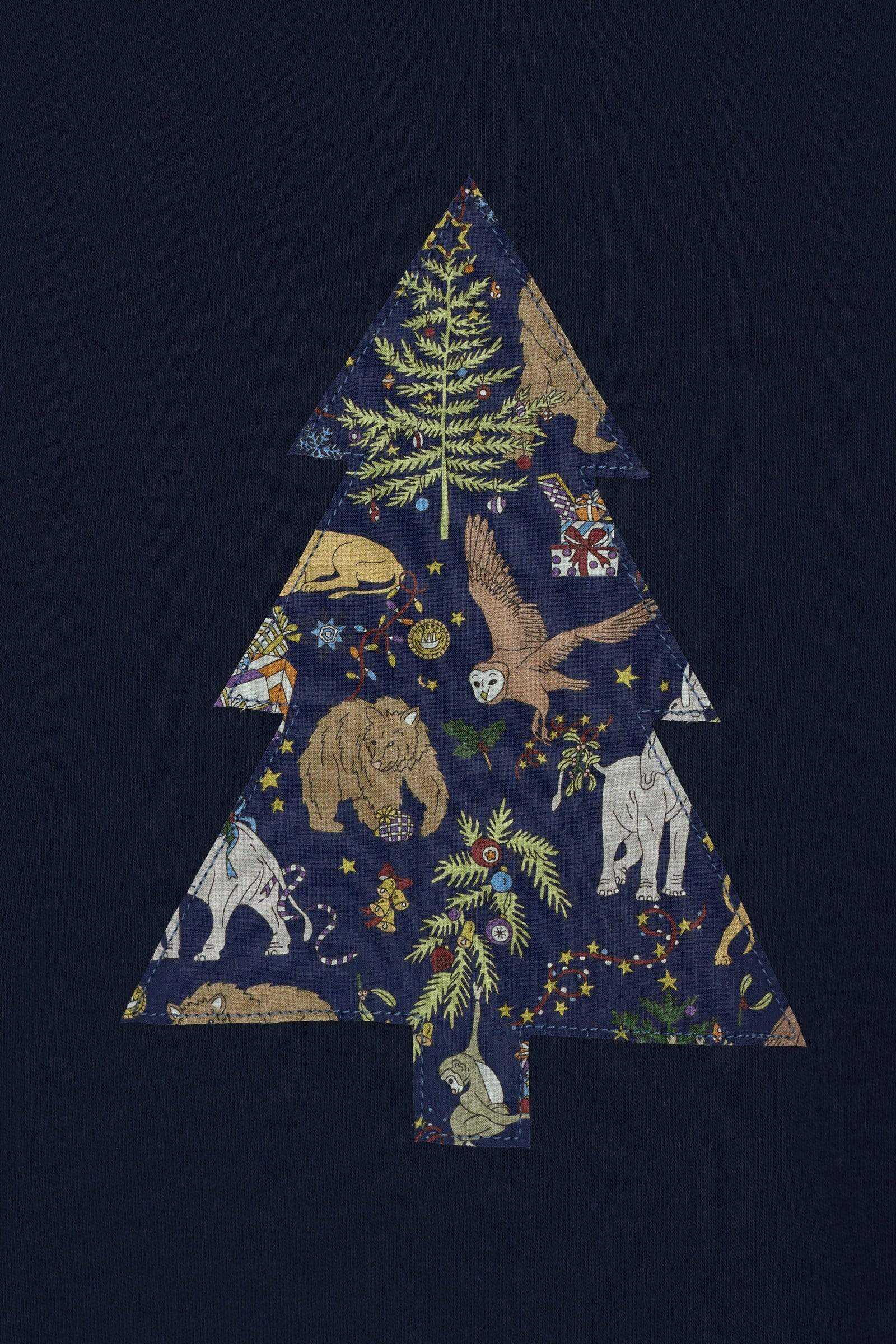 A navy long sleeve Christmas t-shirt with a Christmas Tree on the front made from Liberty Christmas print .